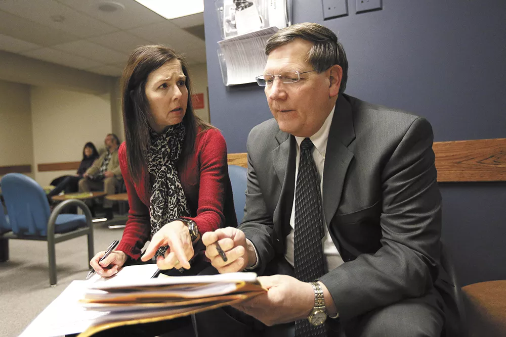 Spokane County Public Defender Dave Carter prepares for a hearing with Tracey Cook, a facilitator in juvenile court. - YOUNG KWAK