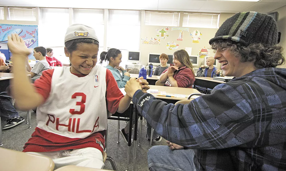 Chad Browneagle (left) and Eli Peterson share a laugh. Proponents of the new education law say it will benefit both native and non-native students. - YOUNG KWAK