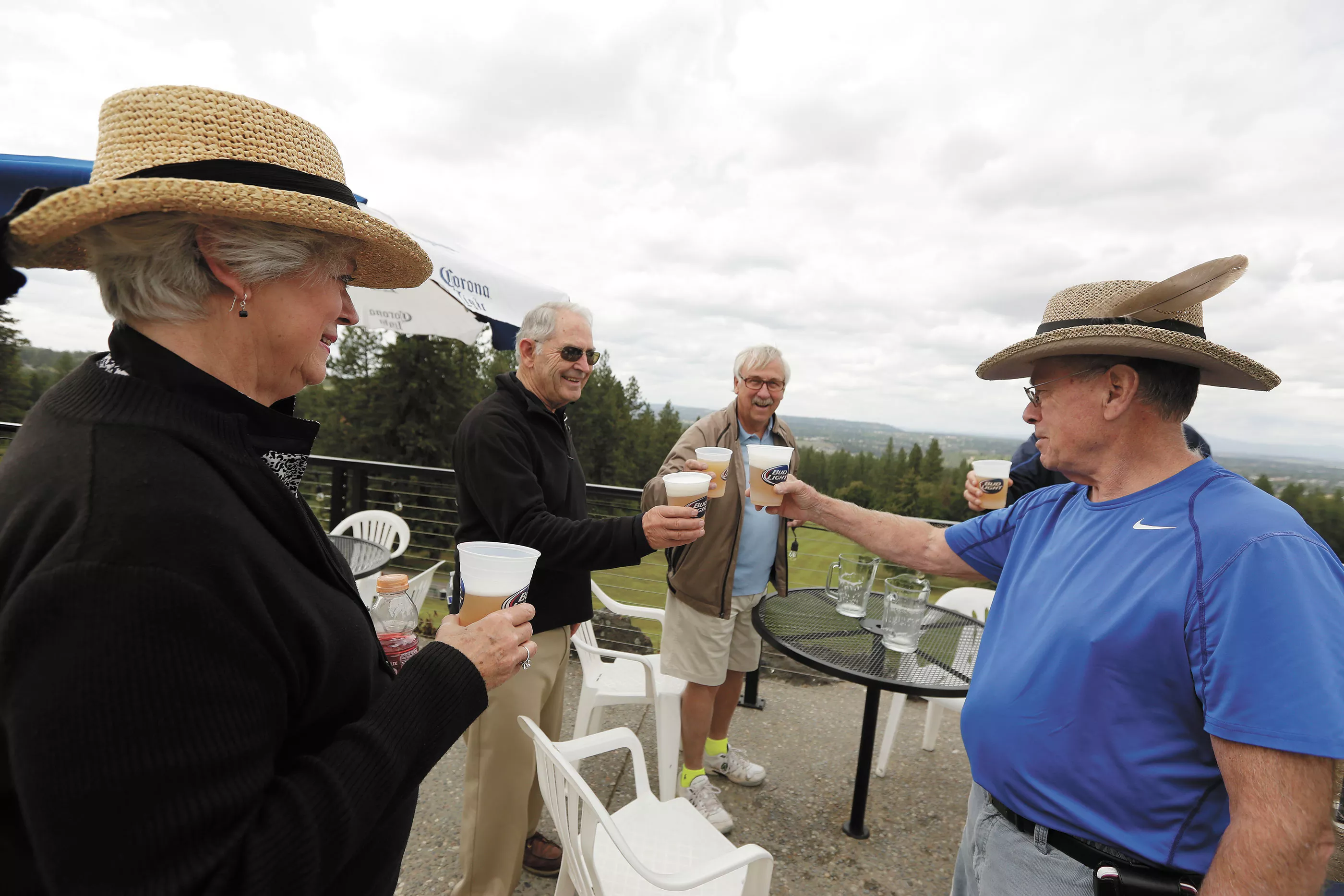 ROM LEFT: Judy Van Hersett, Dave Van Hersett, Gary Grainer and Bob Tenold toast on the patio at the Grill at Indian Canyon Golf Course. - YOUNG KWAK
