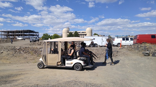 A group of Z-Nation actors hop on a cart for a ride down to a shooting location near the Spokane River.