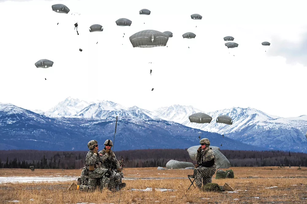 Paratroopers assigned to the 4th Infantry Brigade Combat Team practice a forced-entry parachute assault at a base in Alaska as part of a larger tactical field exercise. - U.S. AIR FORCE/ALEJANDRO PENA PHOTO