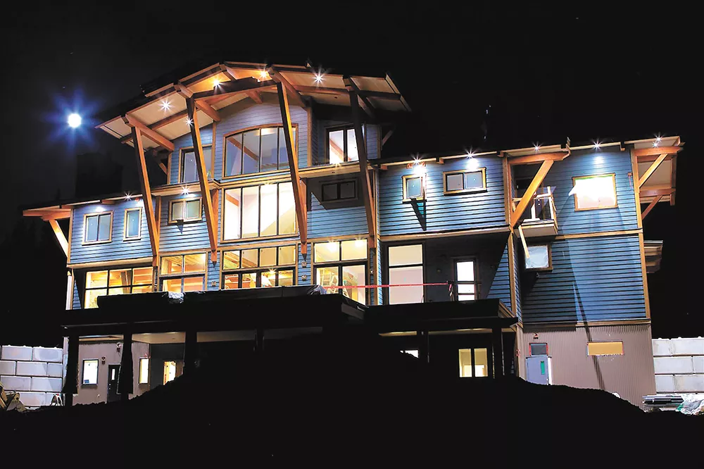 Gostlin's custom-built 10,000-square-foot lodge includes a massage area, wine cellar, game room, hot tub and wood-fired sauna. - BOB LEGASA