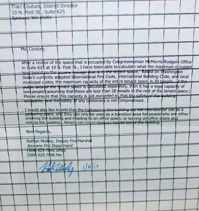 A letter from the deputy fire marshal explains that two people are allowed in the waiting area, but 30 are allowed in the entire office. - DANIEL WALTERS PHOTO