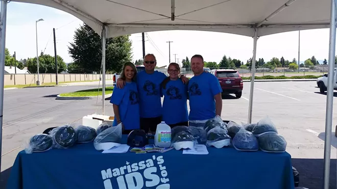 Carrie and Norm Thomson (center) during an annual fundraiser in memory of their son. - COURTESY OF RYAN HOLYK'S FAMILY