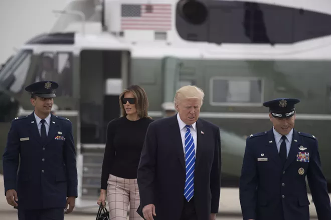 President Donald Trump and first lady Melania Trump on July 5 at Joint Base Andrews in Maryland. - STEPHEN CROWLEY/THE NEW YORK TIMES