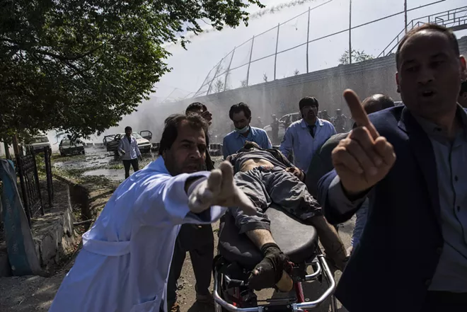 An injured man is taken to an ambulance near the site of a truck bombing that exploded near the Afghan presidential palace and several major foreign embassies, in central Kabul, Afghanistan, May 31, 2017. The long war in Afghanistan continues to set records for civilian casualties, the United Nations mission in the country said on July 17, even as the violence is expected to intensify in the coming months with no hope of peace talks anytime soon. In the first half of 2017, 1,662 civilians were killed, surpassing a record set last year during the same period. - ANDREW QUILTY/THE NEW YORK TIMES