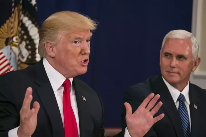 President Donald Trump speaks to reporters, as Vice President Mike Pence looks on. - AL DRAGO/THE NEW YORK TIMES