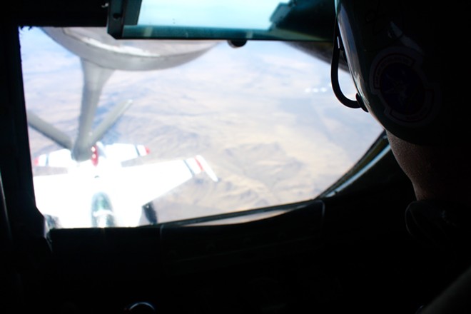Staff Sgt. Travis Peirce operates the boom at the back of a KC-135 Stratotanker, refueling a Thunderbird fighter jet over Nevada on Thursday, Oct. 12. - SAMANTHA WOHLFEIL PHOTO