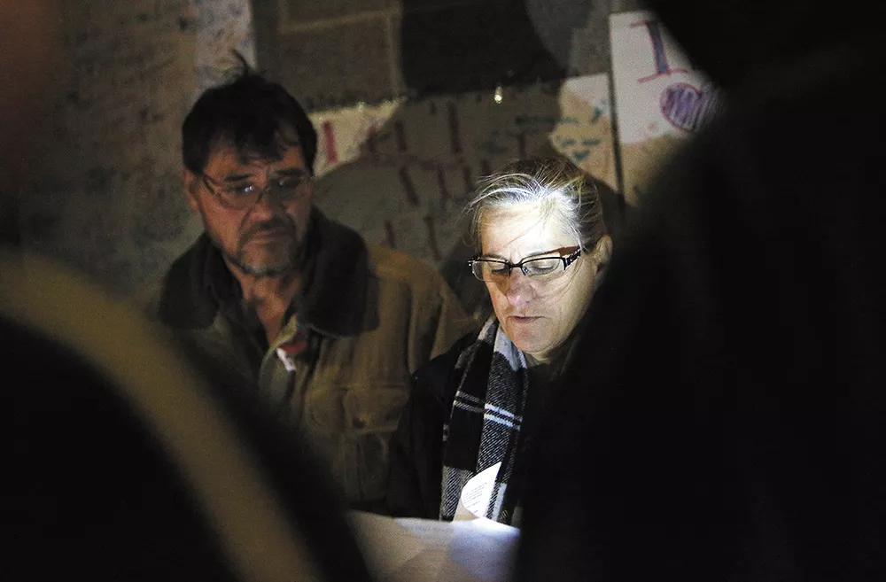 Donna Fagan, pictured in front of her husband, City Councilman Mike Fagan, organized a candlelight vigil on Sunday to pray for those who are lost to their circumstances. - YOUNG KWAK