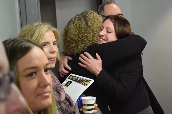 Daybreak CEO Annette Klinefelter, right, hugging Bev Coplin on Tuesday at the opening of the new psychiatric evaluation and treatment center for girls under 18 in downtown Spokane. - WILSON CRISCIONE PHOTO