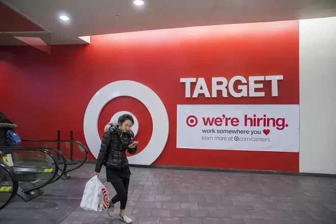 A sign advertises hiring at a Target store in New York, Nov. 19, 2017. Holiday hiring provides an annual jolt to the economy, boosting the incomes of hundreds of thousands of families at Christmas time and providing people a chance to re-enter the labor force, even if only for a few months. - MARK ABRAMSON/THE NEW YORK TIMES
