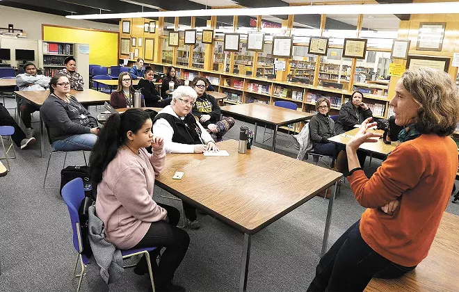 UW anthropology professor Holly Barker, right, talks about the legacy of U.S. nuclear testing at Shaw Middle School. - YOUNG KWAK