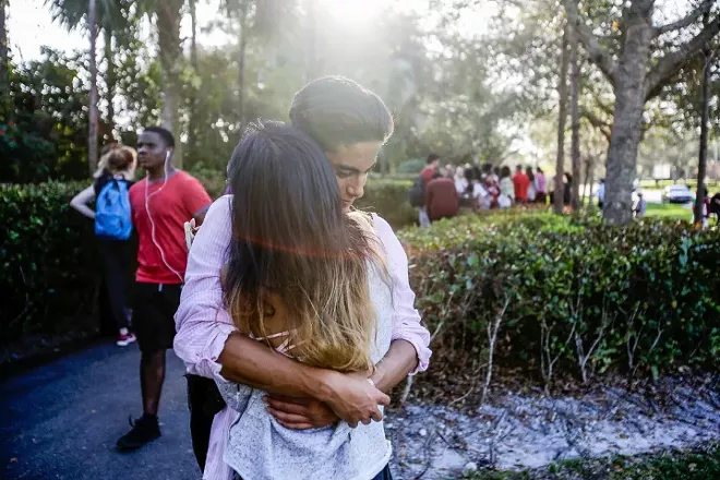 Lavinia Zapata embraces her son, Jorge, after a mass shooting at the Marjory Stoneman Douglas High School in Parkland, Fla., Feb. 14, 2018. On Wednesday, Feb. 28, students were making an emotional return to the classroom. - SAUL MARTINEZ/THE NEW YORK TIMES