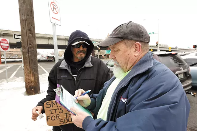 Unlike last year, when surveyors like Bob Peeler recorded homeless residents' answers on paper, this year the city is upgrading to a smartphone app. - YOUNG KWAK