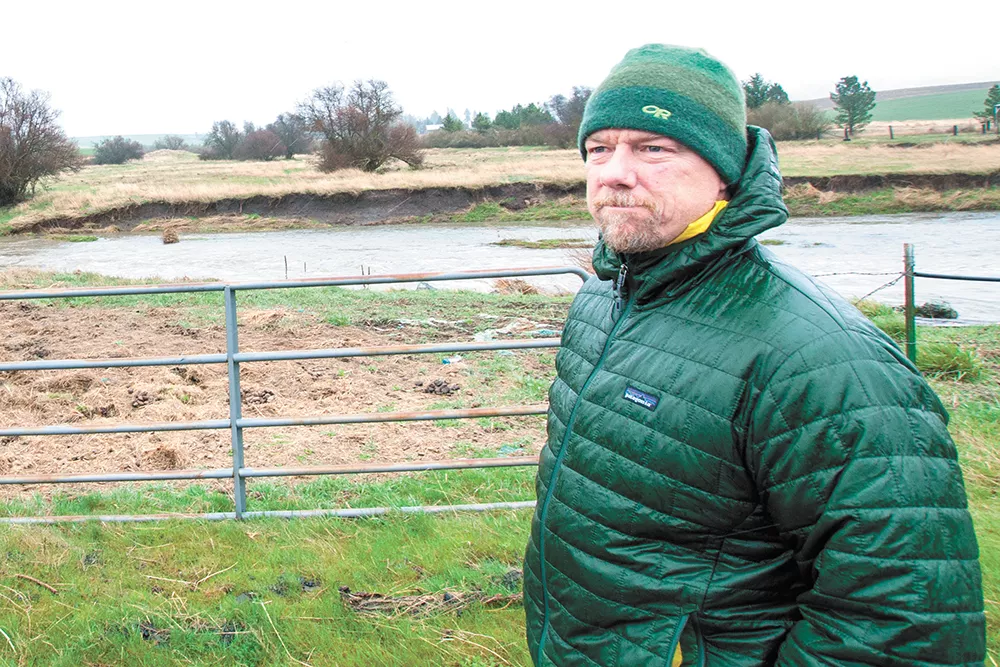 Spokane Riverkeeper Jerry White stands in front of a Hangman Creek property where horses have been allowed to illegally graze. - DANIEL WALTERS PHOTO