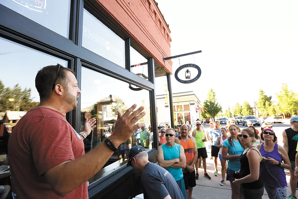 Runners gather outside the Lantern Tap House in the Perry District for a Tuesday evening run. - YOUNG KWAK