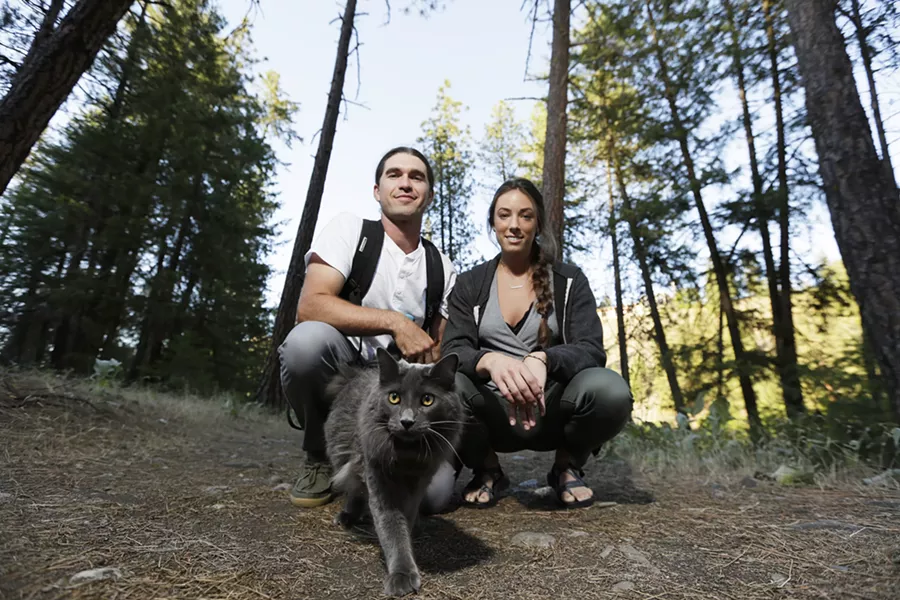 Brendan Love and Ryann Ensrud with Fisher. - YOUNG KWAK