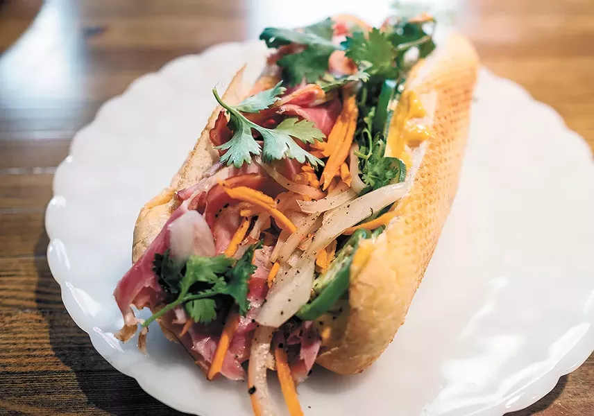 Next Door chef/owner Lindsey Blair's banh mi sandwich. - HECTOR AIZON