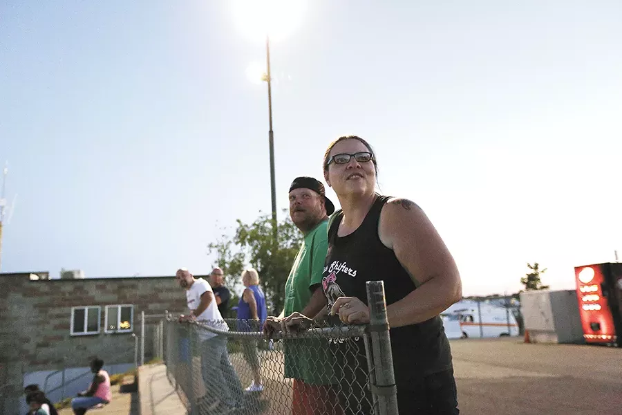 Heather Eller, right, and her husband Cody Eller watch the action on the track. - YOUNG KWAK