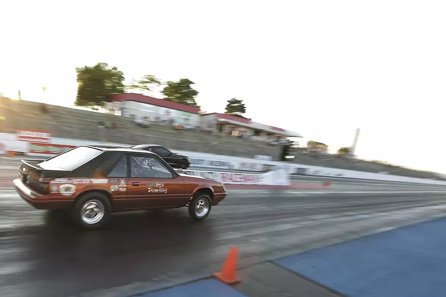 Rachelle Stephens guns her 1984 Ford Mustang GT toward the finish line. - YOUNG KWAK