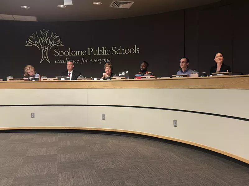 The Spokane Public Schools Board of Directors and superintendent Shelley Redinger (right). - WILSON CRISCIONE PHOTO