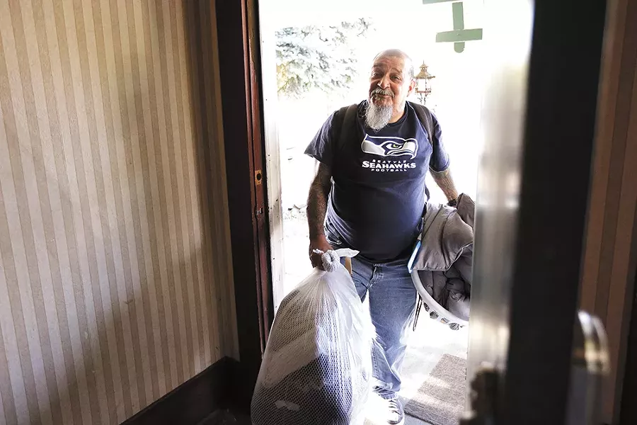 Mora steps into his new home in North Spokane. - YOUNG KWAK