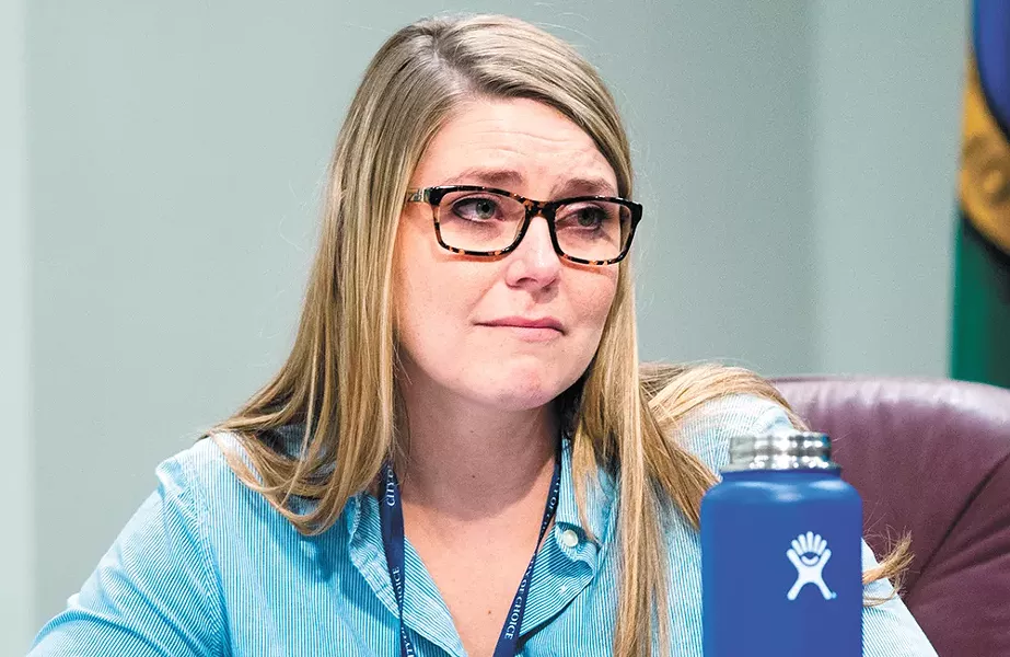 Councilwoman Kate Burke tears up at a recent council meeting where a citizen talked about the coming winter and the danger it posed to homeless people. - DANIEL WALTERS PHOTO