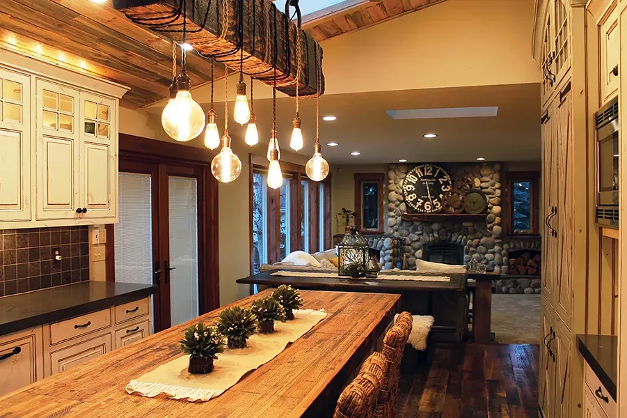 To add a focal point to this kitchen, Shaleesa Mize specified a unique light fixture crafted from reclaimed wood by Spokane's Dare Designs. - SHALEESA MIZE PHOTO