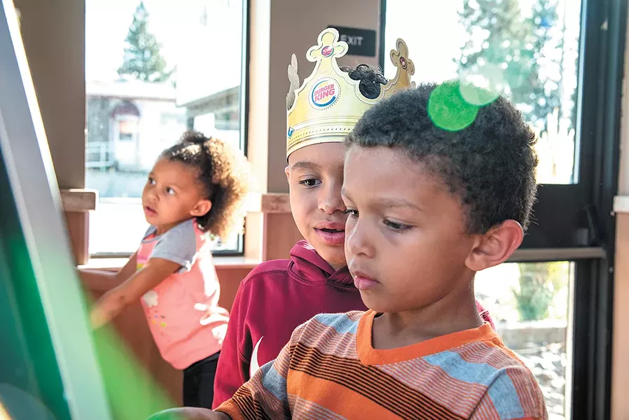 Isaiah (wearing the crown) reunited with his younger brother and sister, Thomas and Charlotte, in a Burger King play place. |erick doxey photo - YOUNG KWAK