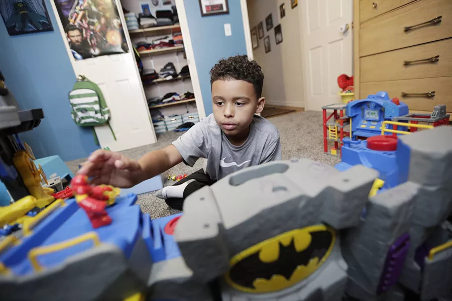 Isaiah Muse, 7, was adopted by relatives after losing his parents at age 4. - YOUNG KWAK
