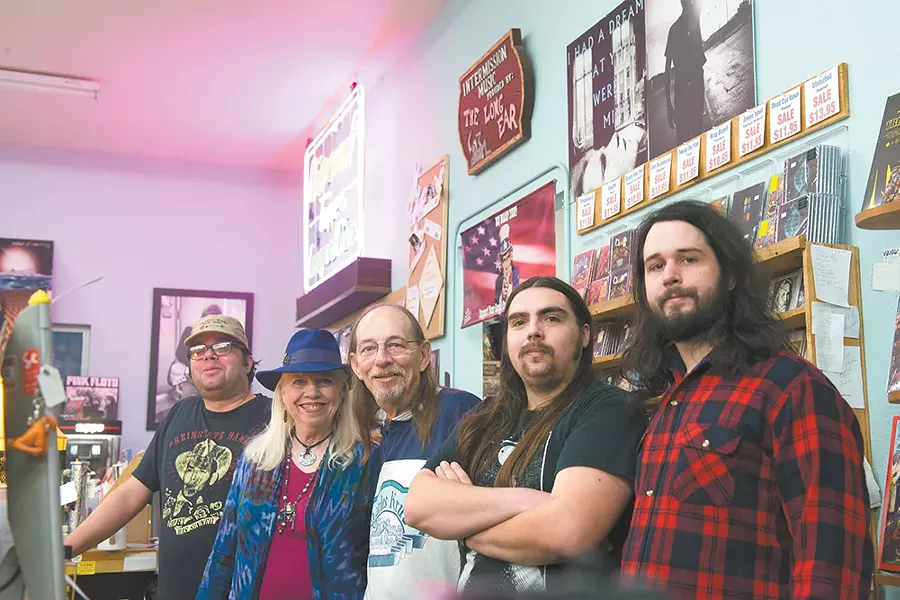Husband and wife Deon and Terry Borchard (second and third from left) opened the first Long Ear record store in 1973, and they're celebrating its 45th anniversary on Saturday. - DEREK HARRISON
