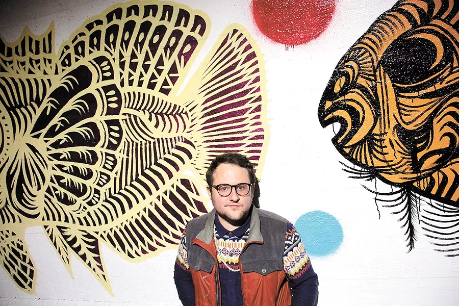 Spokane muralist Matt Smith and his new work on Stevens Street. - QUINN WELSCH PHOTO