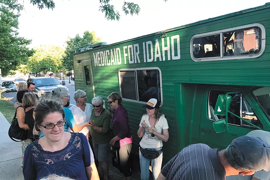 Bryn Ballenger, one of the 62,000 Idahoans stuck in the Medicaid gap (in the center with the trucker hat), attends a Medicaid for All kickoff event in Sandpoint. - EMILY STRIZICH PHOTO