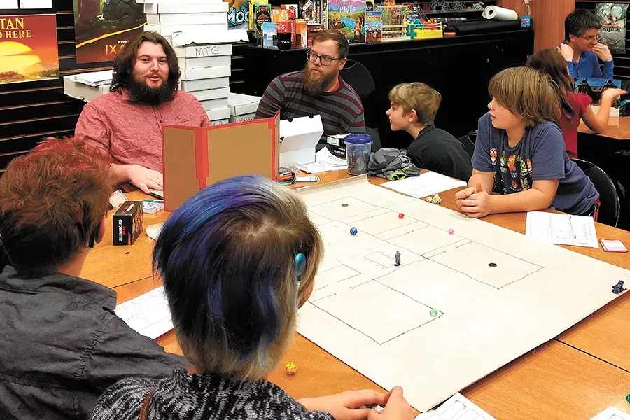 Irvin Reynolds, top left, leads weekly D&D sessions for kids at Uncle's Games. - CHEY SCOTT PHOTO