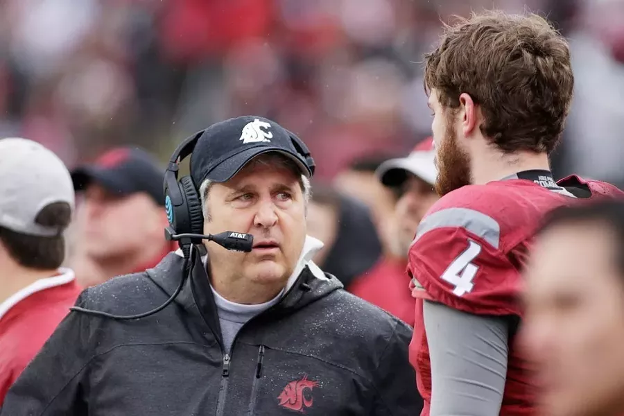 Mike Leach would like to impart his knowledge of football to more than just football players. - YOUNG KWAK