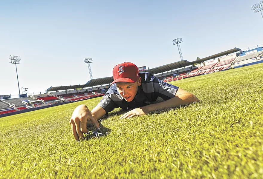 Spokane Indians' head groundskeeper David Yearout keeps a close eye on the grass at Avista Stadium. - YOUNG KWAK