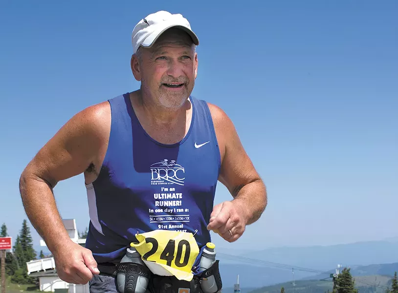 Larry Taylor makes his way up the grueling Mount Spokane section of the Let's Climb a Mountain course. - RON NUTKOWITZ PHOTO