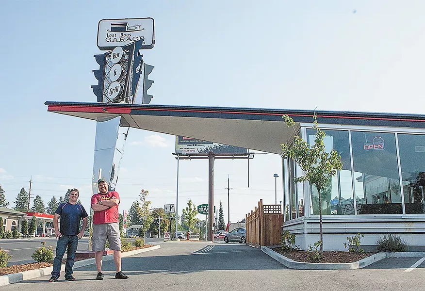 Owners Kevin Pereira (left) and Jhon Goodwin outside of Lost Boys Garage Bar & Grill. - MEGHAN KIRK