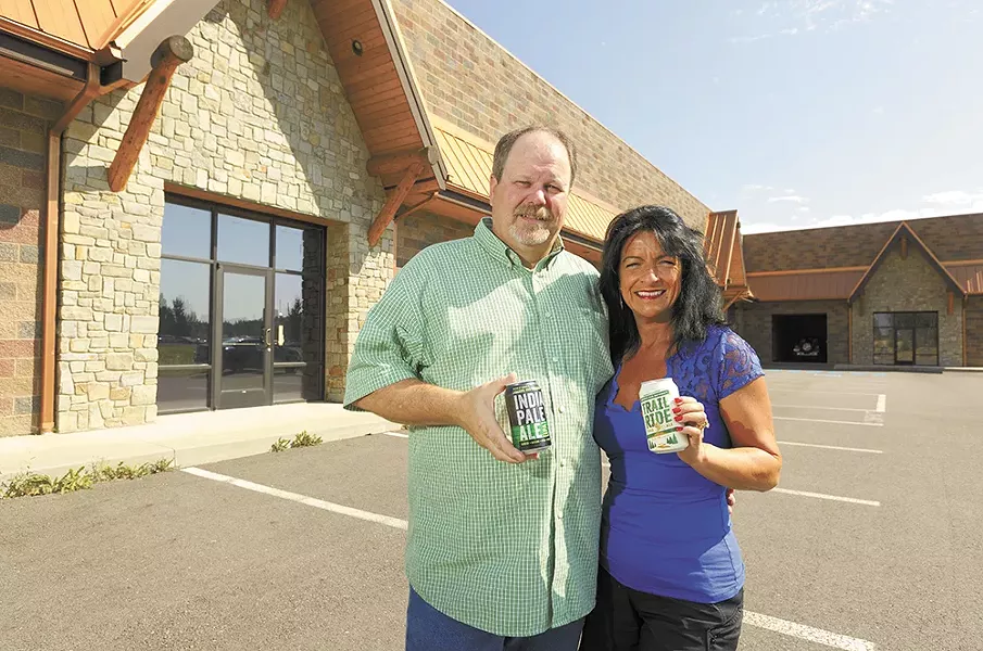 Laughing Dog co-owners Fred and Michelle Colby outside the future Laughing Dog Brewing production facility. - YOUNG KWAK