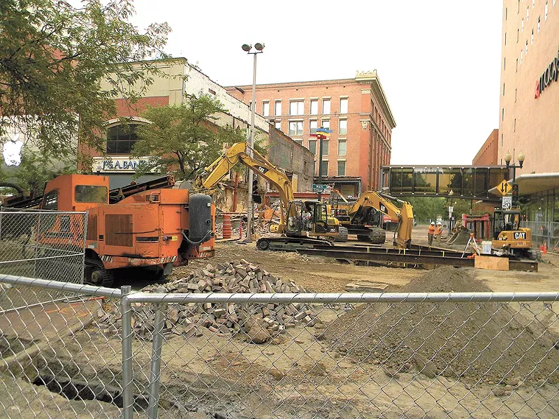 The intersection at Main Avenue and Wall Street is closed off as the Saad Building is demolished to make room for Urban Outfitters. - JAKE THOMAS