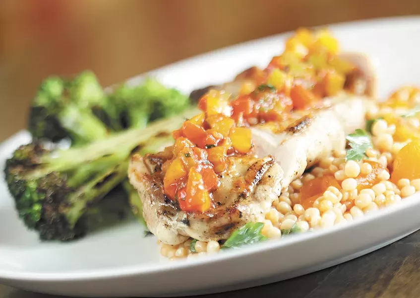Grilled chicken apricot fregula and diavolo sauce at Italia Trattoria. - YOUNG KWAK