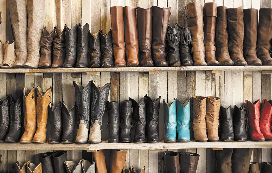 Walls of vintage boots are on display at Vintage Angel. - YOUNG KWAK