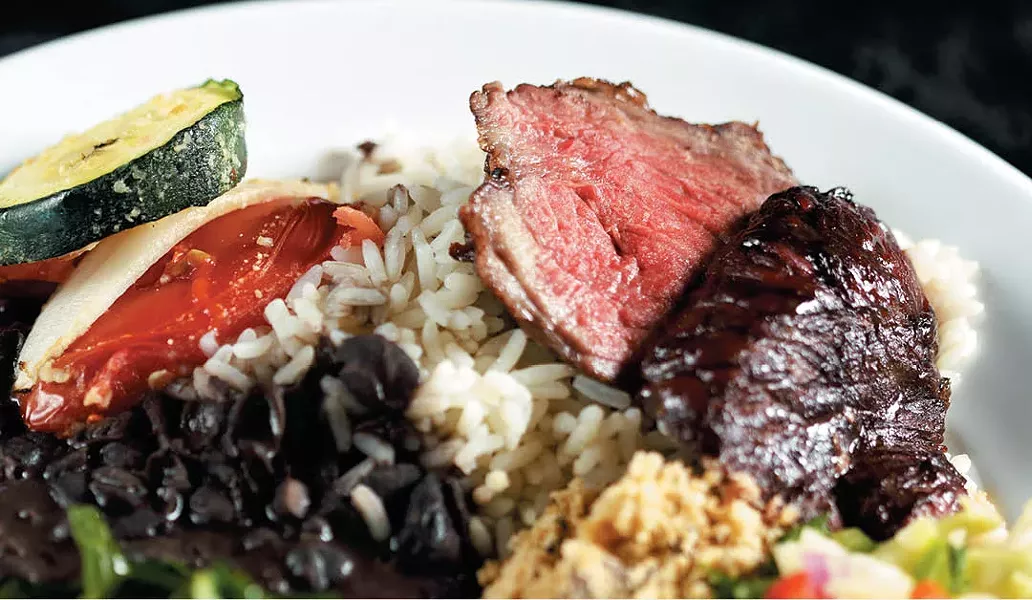 A heaping plate of steak, greens and rice at the Grille from Ipanema. - YOUNG KWAK