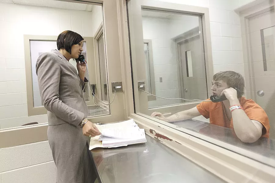 Lisa Chesebro, a Kootenai County public defender, meets with Gavin Ottomeier, who is facing a felony charge of intent to deliver marijuana that carries a possible five-year prison sentence. - YOUNG KWAK