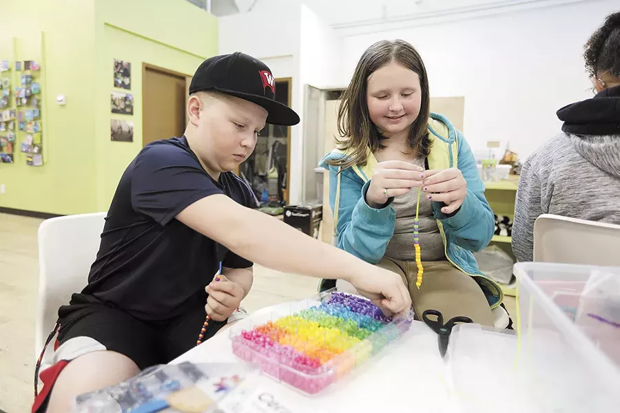 Sixth graders Owen and Jazmyn make bracelets as part of class. - YOUNG KWAK