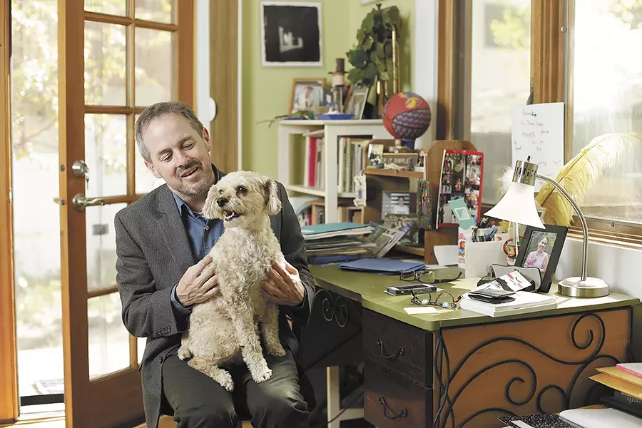 The poet and his dog, Teddy, in his home office. Says Tod Marshall: "When I was in high school, I hated poetry." - YOUNG KWAK