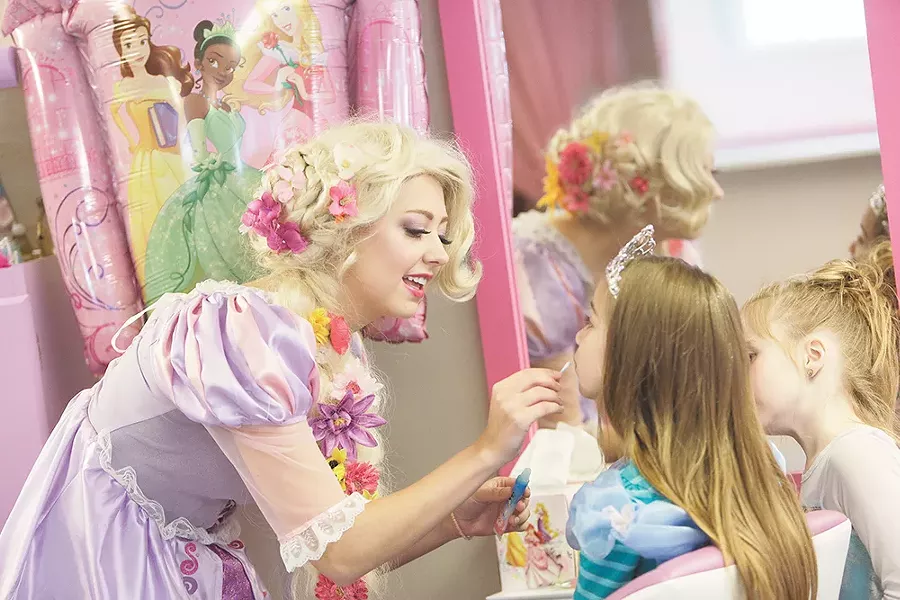 In the role of Rapunzel, Lauren Block entertains a group of young girls during a recent princess birthday party. - YOUNG KWAK