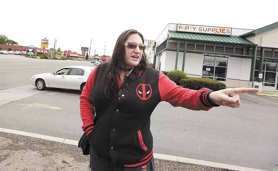 Lacey Hendrix in front of the spot where a driver hit her on her bike two years ago. - YOUNG KWAK