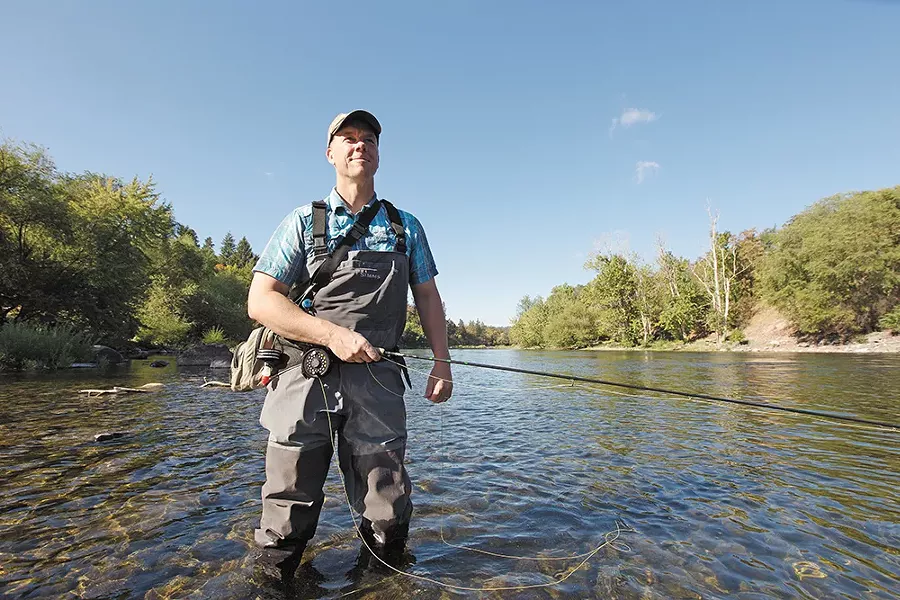 Spokane Riverkeeper Jerry White in the Spokane River near Peaceful Valley. - YOUNG KWAK