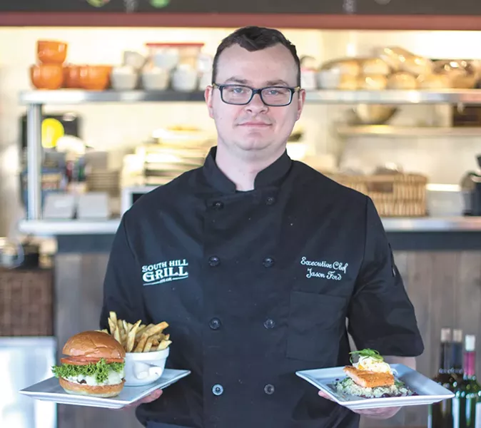 Executive Chef Jason Ford with his South Hill Grill Burger and ginger salmon dish. - MAC BOOEY